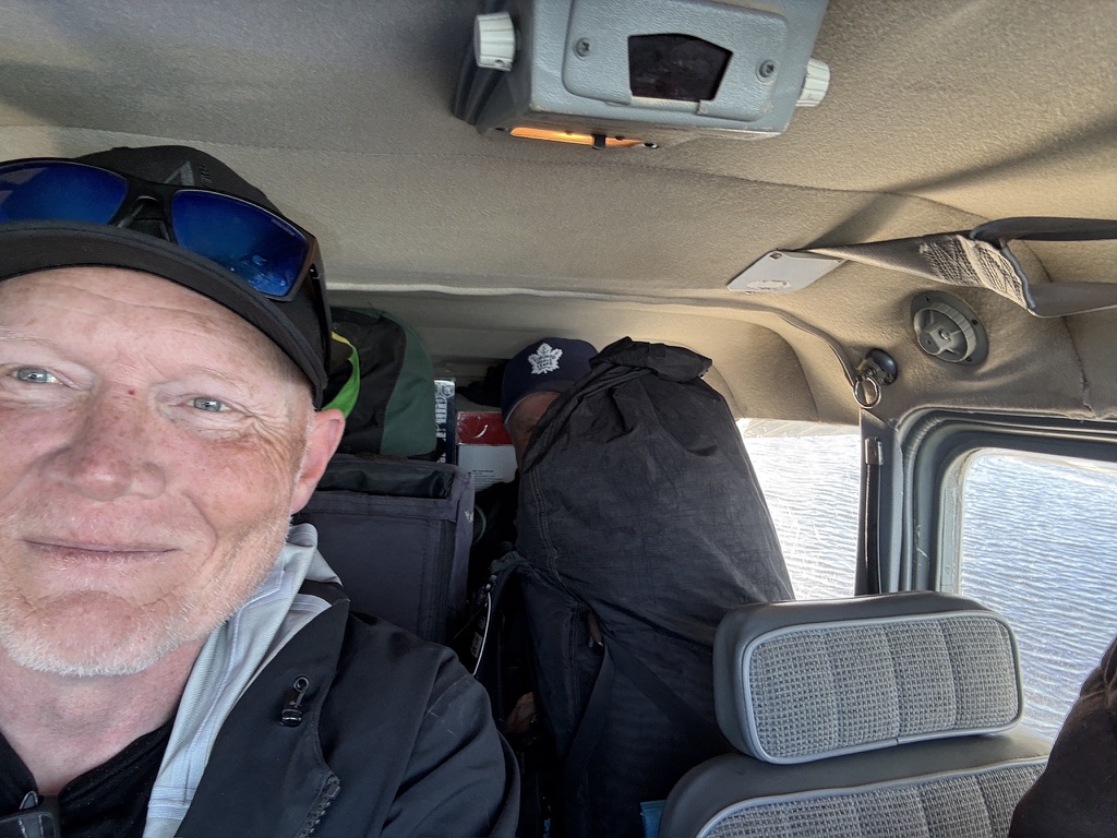 It's hard to see, but that's Chris under that bag. We were still jammed in the small plane on the way home, but we made it!