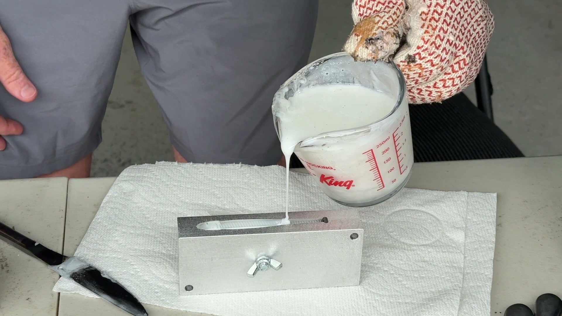 Pouring hot plastisol into an open swimbait mold