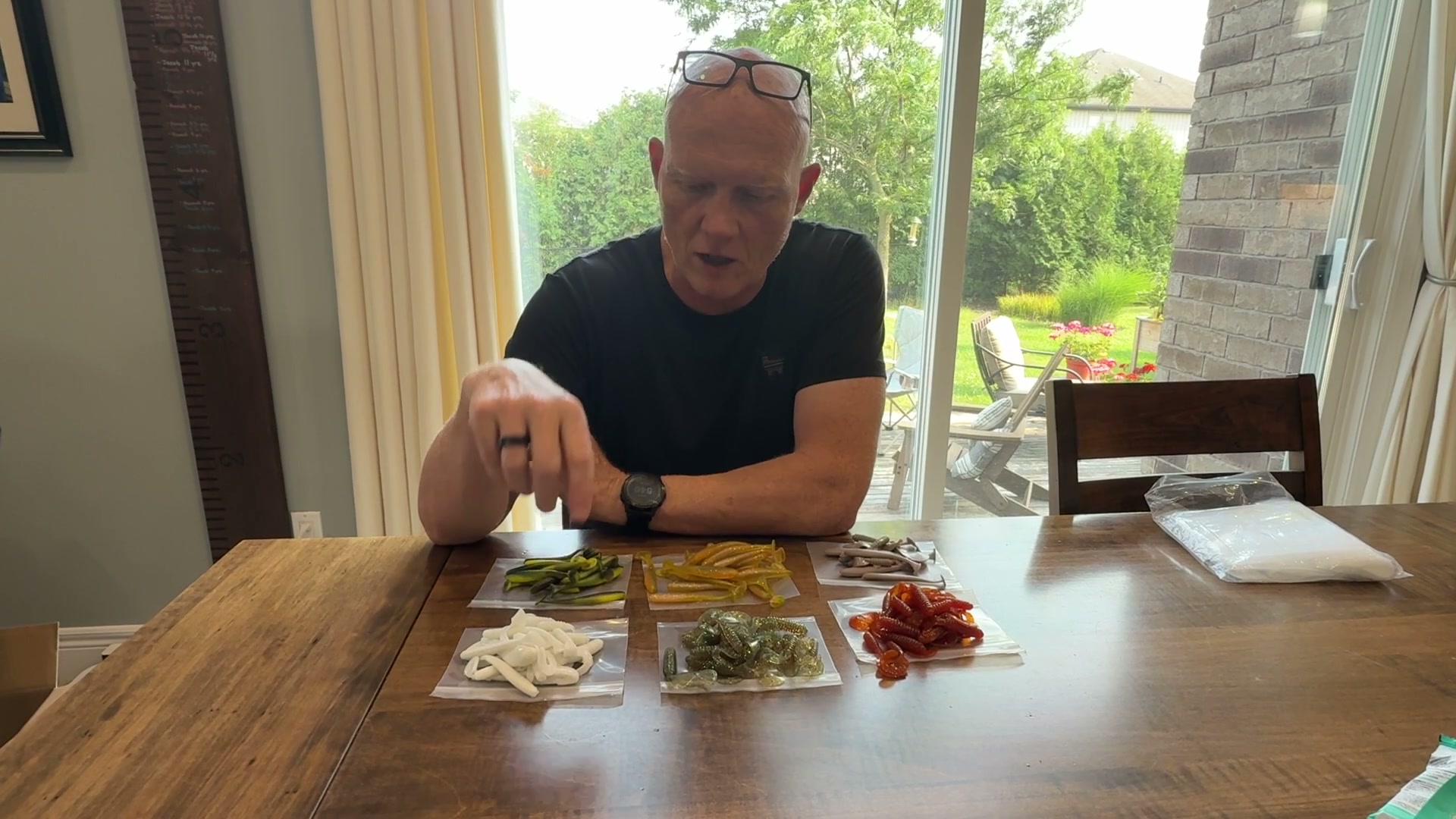 Six sets of home poured soft plastic baits laid out on a table