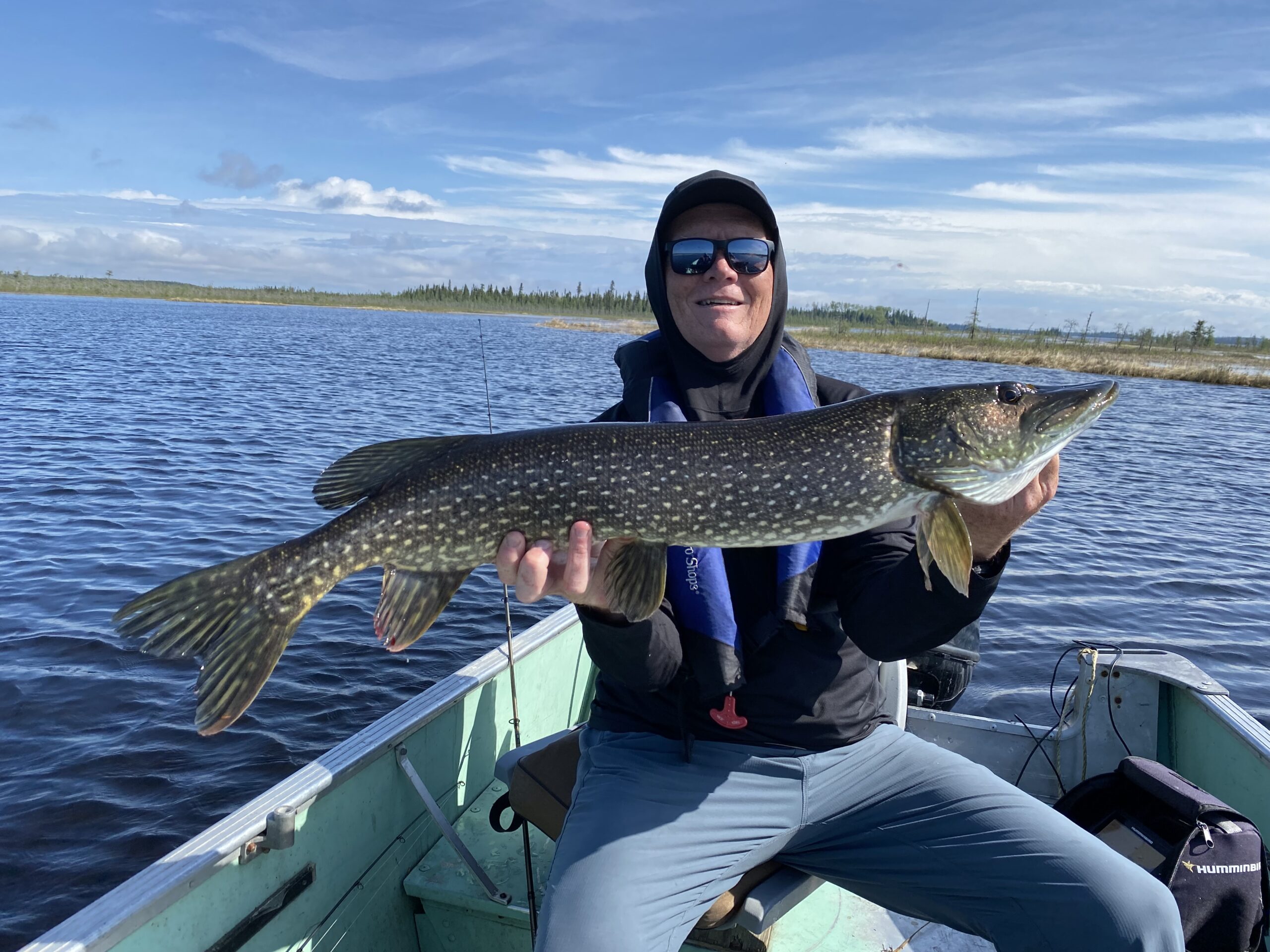 Scott holding a northern pike on Kag
