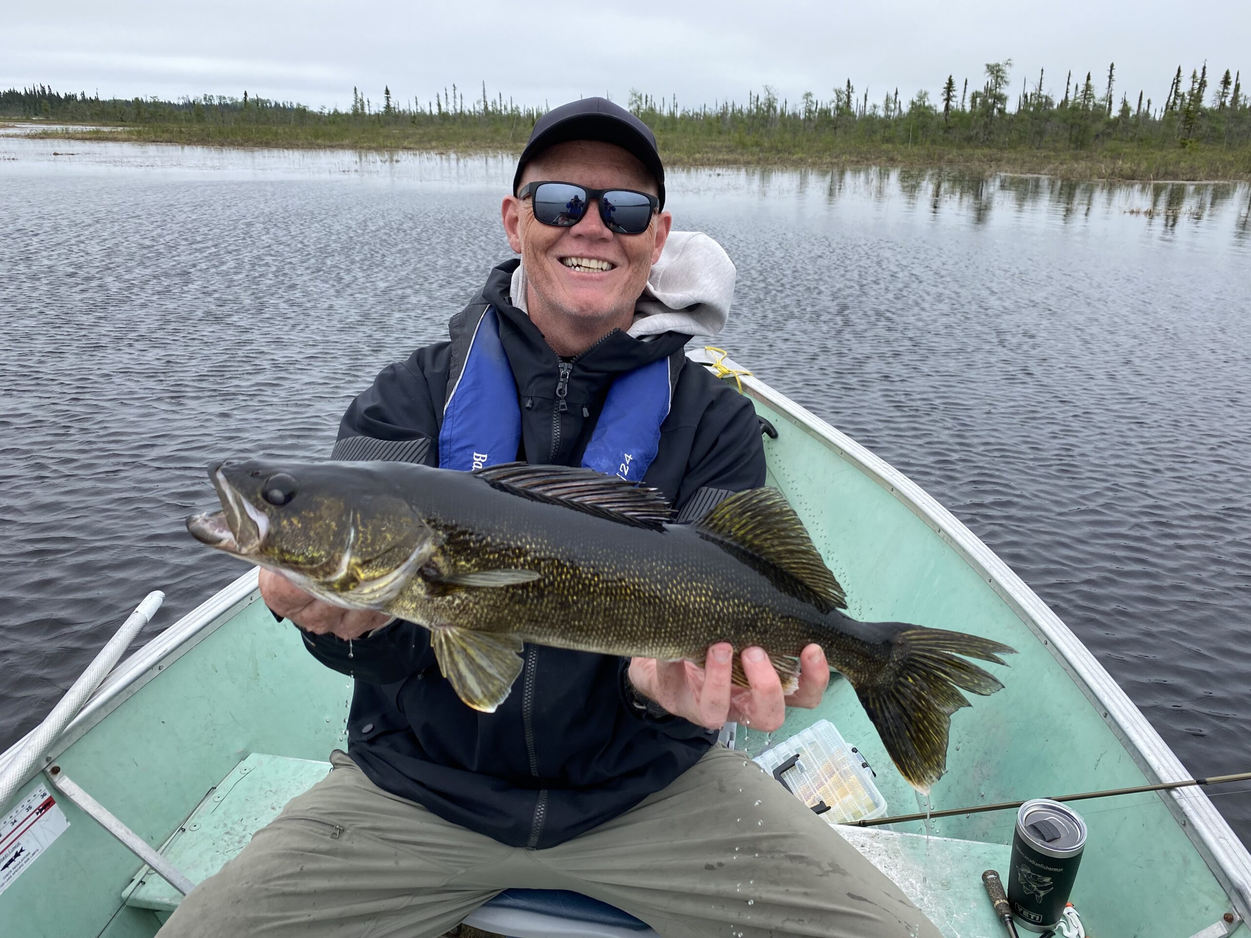 Scott holding a big walleye on Kag